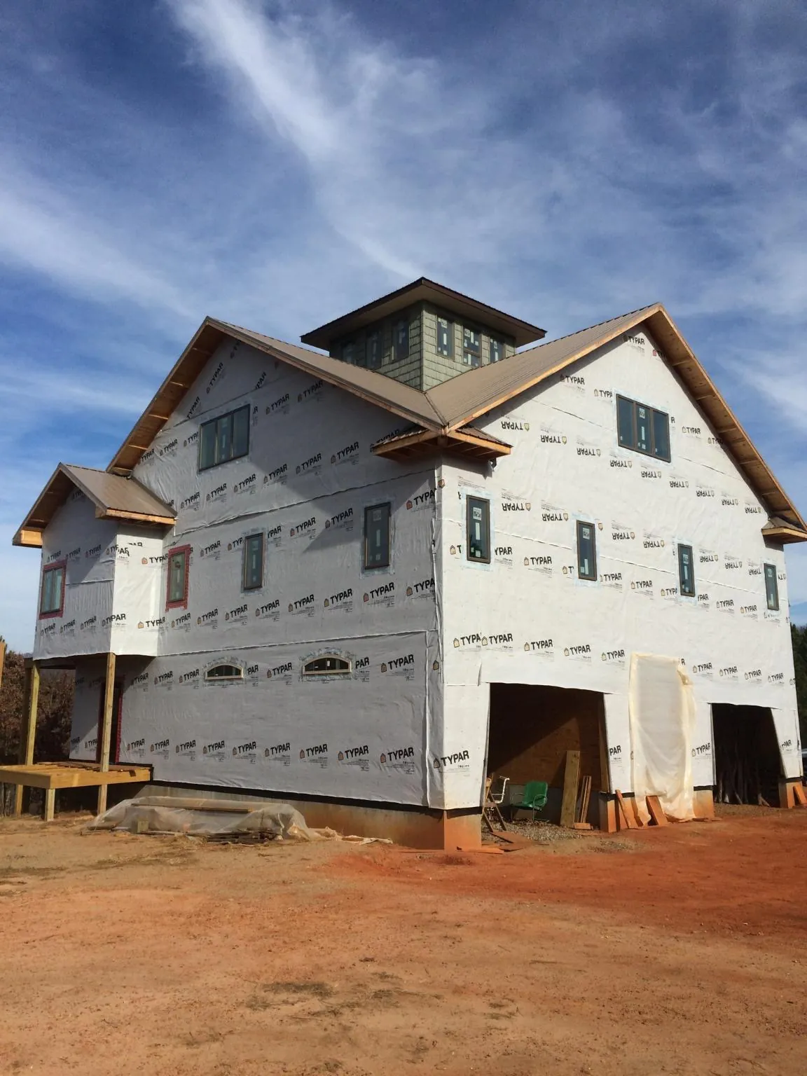 New two story house under construction with a cupola and gabled roofs in Camden